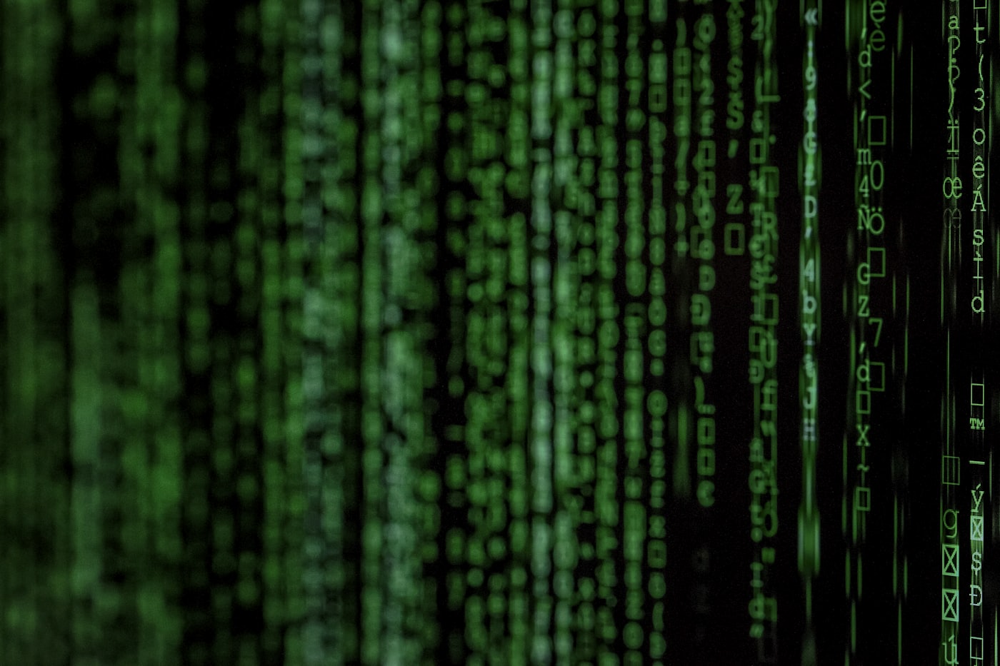 Close-up of green code on a dark terminal screen